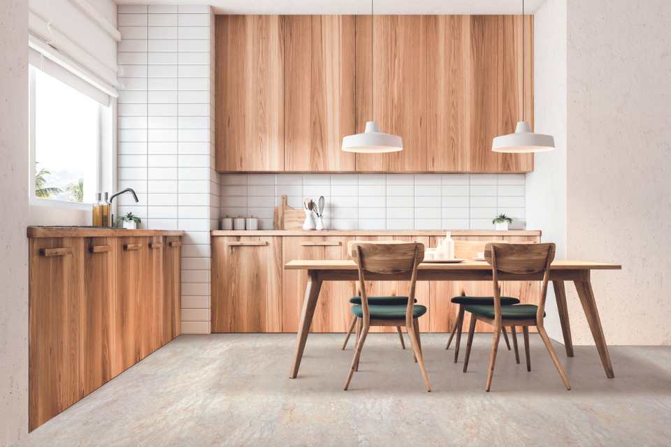 stone look vinyl in light bright kitchen with wood cabinetry and subway tile